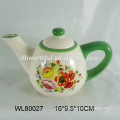 Ceramic teapot with flower decal design